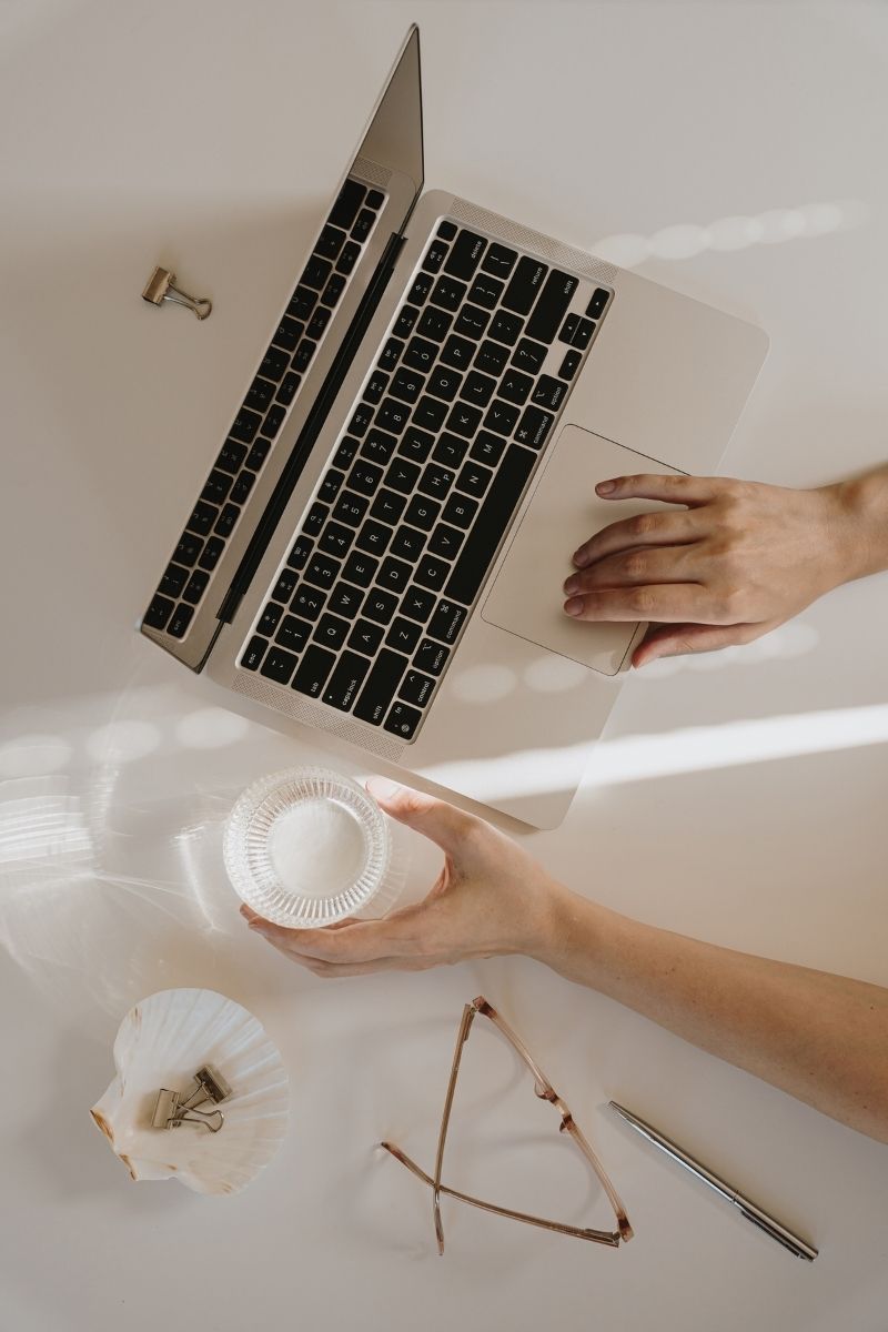 Preview of a minimalist Canva brand board template with editable text, color swatches, and font sections, labeled “Free Download