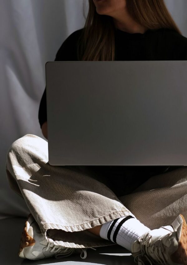 woman on laptop using canva, showing an example of 3 canva font pairings, free canva template download